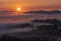 Mountains in fog at beautiful morning in autumn in Dalat city, Vietnam. Royalty Free Stock Photo