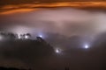 Mountains in fog at beautiful night in autumn in Dalat city, Vietnam.