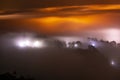 Mountains in fog at beautiful night in autumn in Dalat city, Vietnam. Royalty Free Stock Photo