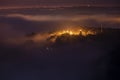 Mountains in fog at beautiful night in autumn in Dalat city, Vietnam. Royalty Free Stock Photo