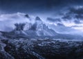 Mountains in fog at beautiful night. Dreamy landscape