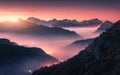 Mountains in fog at beautiful sunset in autumn in Dolomites, Ita Royalty Free Stock Photo