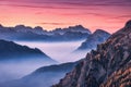 Mountains in fog at beautiful sunset in autumn Royalty Free Stock Photo