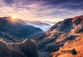 Mountains in fog at beautiful sunset in autumn