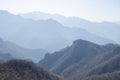 Mountains foggy white blue sky. Chinese autumn mountains.