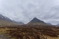 The mountains of Glen Coe in the Scottish Highlands on a wet, overcast day in April, with snow still visible on the Hills,