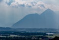 The mountains are just silhouettes in the distance due to fog blocking the view seen from Hohensalzburg