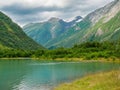 Mountains and lake besides Boyabreen Glacier, nORWAY Royalty Free Stock Photo