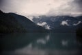 Mountains, lake, clouds, reflection on a rainy day Royalty Free Stock Photo