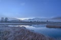 Mountains lake fog reflection dawn blue Royalty Free Stock Photo