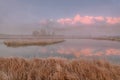 Mountains lake island fog dawn reflection autumn Royalty Free Stock Photo