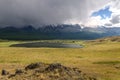 Mountains lake overcast storm clouds sunlight Royalty Free Stock Photo