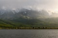 Mountains lake overcast sunlight fog Royalty Free Stock Photo