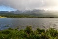 Mountains lake overcast sunlight fog Royalty Free Stock Photo