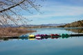 Mountains and lake with paddle boats Royalty Free Stock Photo