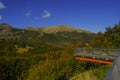 Mountains landscape across blue sky annd a bridge with binocular across the scenic view. Mountains background. Parco Nazionale del