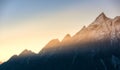 Mountains and low clouds at colorful sunrise in Nepal Royalty Free Stock Photo