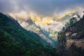 Mountains in low clouds in overcast evening in Nepal