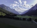 Mountains and meadows in a beautiful landscape in Austria at the Brenner Pass at sunset Royalty Free Stock Photo
