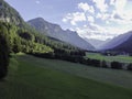 Mountains and meadows in a beautiful landscape in Austria at the Brenner Pass at sunset Royalty Free Stock Photo