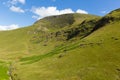 Mountains by Moss Force waterfall Lake District National Park Cumbria uk on a beautiful blue sky summer day Royalty Free Stock Photo