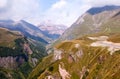 Mountains and mountain road in autumn in Georgia. Magic enchanting nature, high mountains covered with white snow under a blue sky