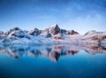 Mountains at the night time. Mountains and reflections on the water surface on Lofoten islands, Norway. Starry sky over the mounta Royalty Free Stock Photo