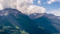 The mountains of the Ortler group on a sunny day with passing low clouds seen from Silandro, South Tyrol, Italy. Time lapse motion