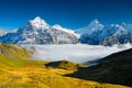 Mountains peaks and clouds in the valley. Natural landscape. Mountain range through the clouds. Landscape in the summertime. Royalty Free Stock Photo