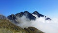 Mountains peaks over clouds