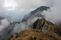 Mountains peeks surrounded by clouds Royalty Free Stock Photo