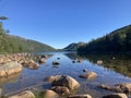 Mountains pop out from the gorgeous Jordan Pond Royalty Free Stock Photo