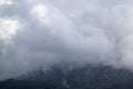 Mountains with rainy grey ominous clouds