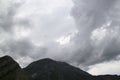 Mountains with rainy grey ominous clouds