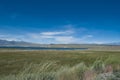 Mountains range and valley, blue water lake and blue sky Royalty Free Stock Photo