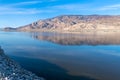 Mountains reflecting along the shoreline of Owens Lake, California, USA