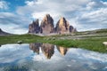 Mountains reflection on the water surface. Natural landscape in the Dolomites Alps in the Italy.