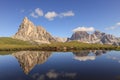 Mountains reflection on waterhole, dolomites, Giau pass, Veneto, italy