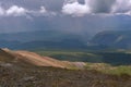 Mountains road serpentine pass poppies storm Royalty Free Stock Photo