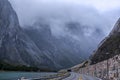 Mountains road with tunnel near Ãâ¦ndalsnes and Trollstigen in Norway, rocky hills and river, scenic