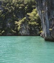 Mountains, rocks, trees, green sea