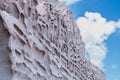 Mountains of sand drawn by the wind in a beach on the coast of Santorni island