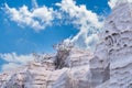 Mountains of sand drawn by the wind in a beach on the coast of Santorni island