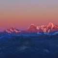 Mountains Schreckhorn, Eiger and Monch at sunset. View from Mount Niesen. Switzerland. Royalty Free Stock Photo