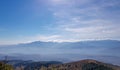 Mountains silhouette through mist with beautiful horizon.