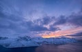 Mountains and sky during sunset. Senja island, Norway. Clouds on the sky during sundown.