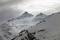 Mountains in snow in cloudy weather Royalty Free Stock Photo