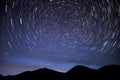 Mountains star tracks sky glow Royalty Free Stock Photo