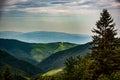 Mountains in a summer day with cloudy background and sunrays