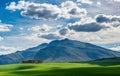 Mountains on a sunny day with clouds on the sky.